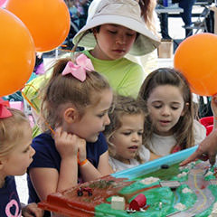 Children participate with an interactive storm water demonstration