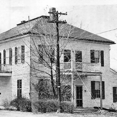The Krekel House, O'Fallon's first residence, as seen in the mid-20th century. Today, Cleo Bridal operates out of this historic building.