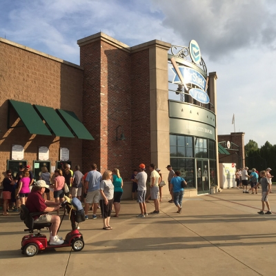 Patrons line up at the CarShield ticket booths