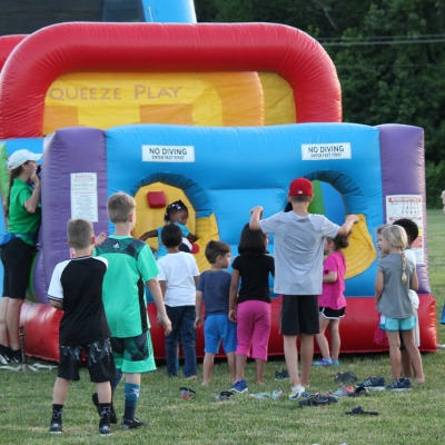 Giant inflatables are on-site for kids to romp around.