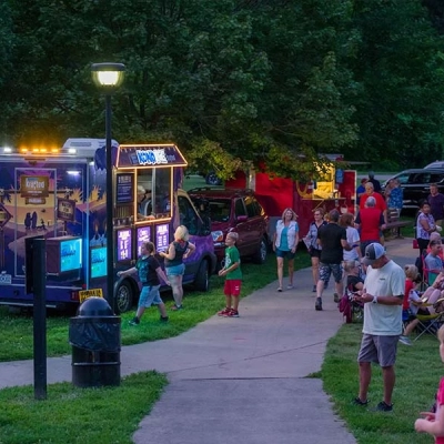 Sno-cones are handed out by food truck vendor