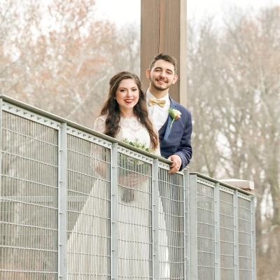 A couple looks over the balcony railing at O'Day Lodge