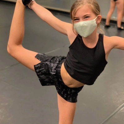 Under the mask is a big smile from this Civic Dance Studio dancer.