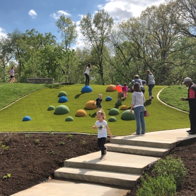 Kids playing on a hillside at O'Day Park