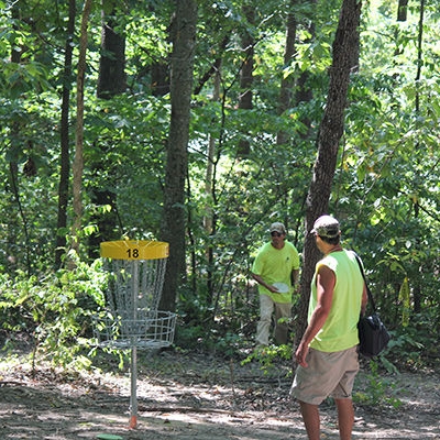 Two golfers finish their round at Hole #18